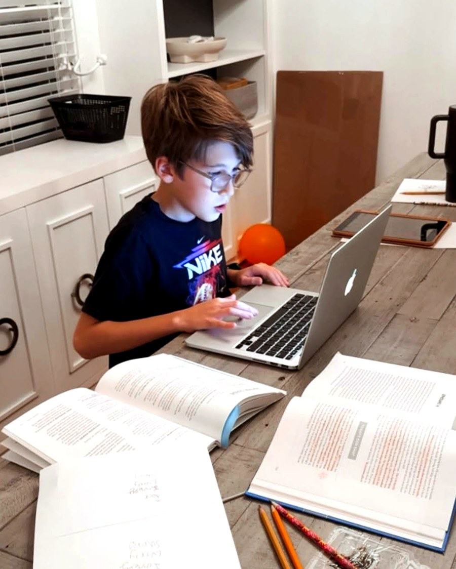 A student completing schoolwork at home